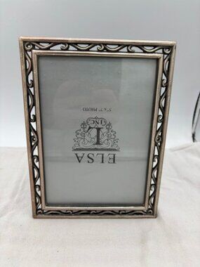 Elsa L. Inc. 5" X 7" Silver frame.